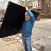 Solar States owner Micah Gold-Markel carries a solar panel from a truck to the house where it will be installed.