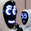 A pair of 1X androids are displayed at the International Conference on Robotics and Automation (ICRA) at ExCel on May 30, 2023, in London.