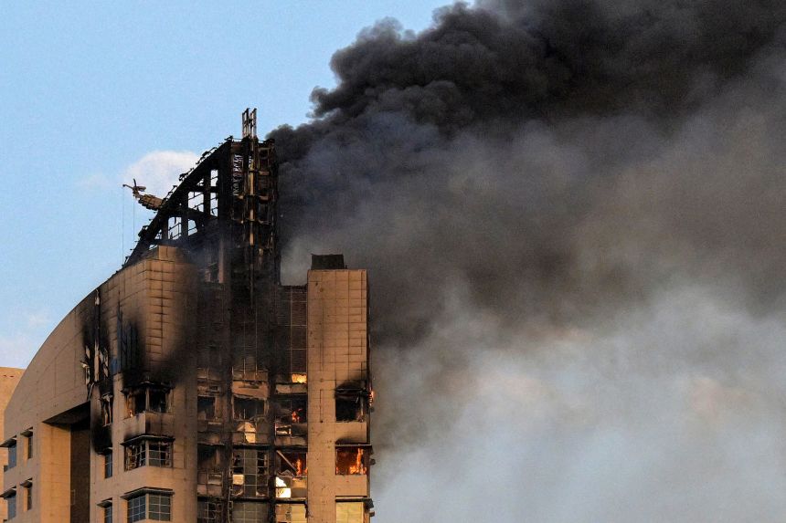 Smoke rises from a high-rise building in Kuwait City, following a drone attack on March 8.