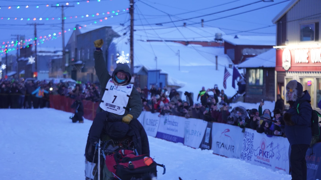 2026 Iditarod Trail Sled Dog Race champion Jessie Holmes arrives at the 1,000-mile race's finish line in Nome the evening of Tuesday, March 17, 2026.