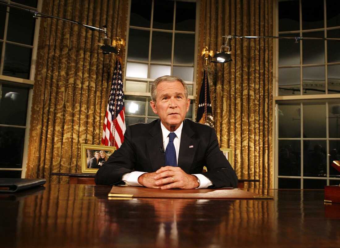 President George W. Bush poses for photographers after addressing the nation on the military and political situation in Iraq from the White House on Sept. 13, 2007.