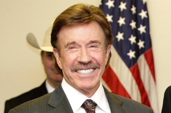 Chuck Norris appears at a ceremony in Garland, Texas on Dec. 2, 2010. (AP Photo/Tony Gutierrez, File)