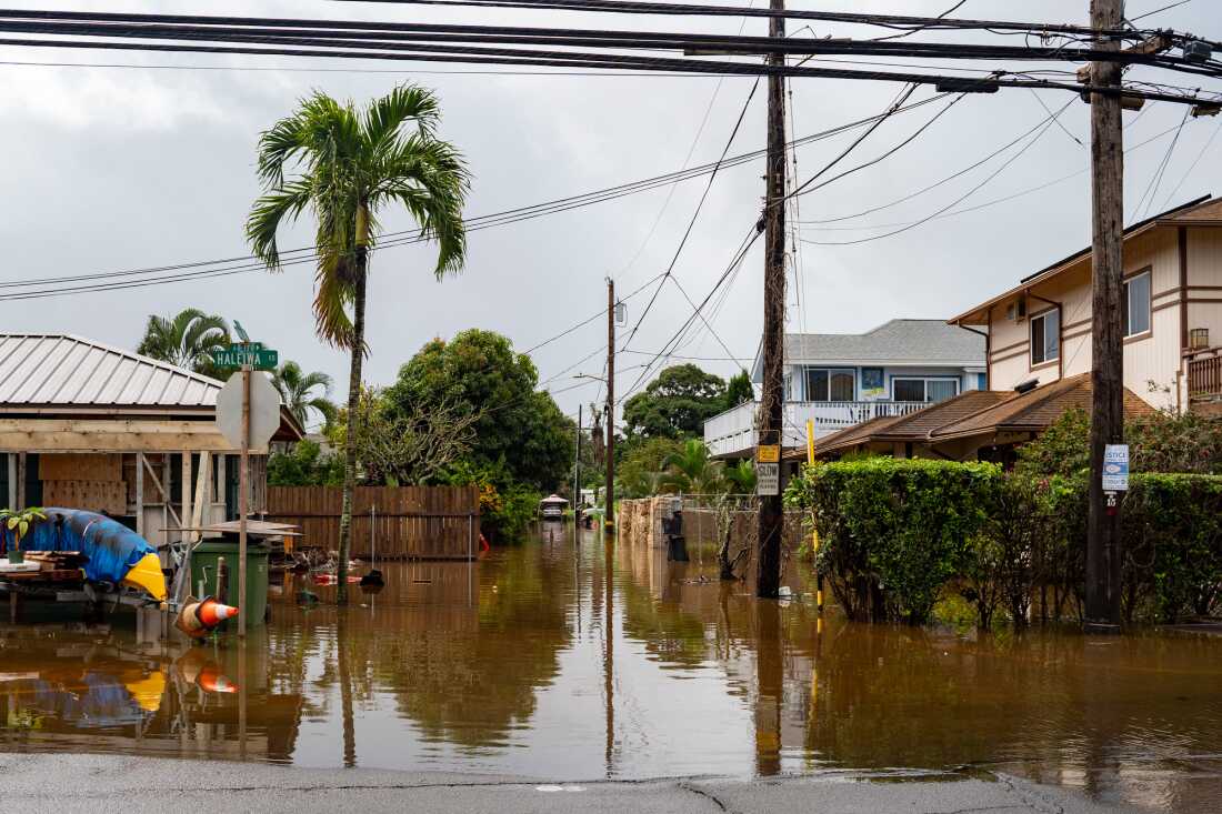 Streets are flooded from severe rains Friday in Haleiwa, Hawaii.