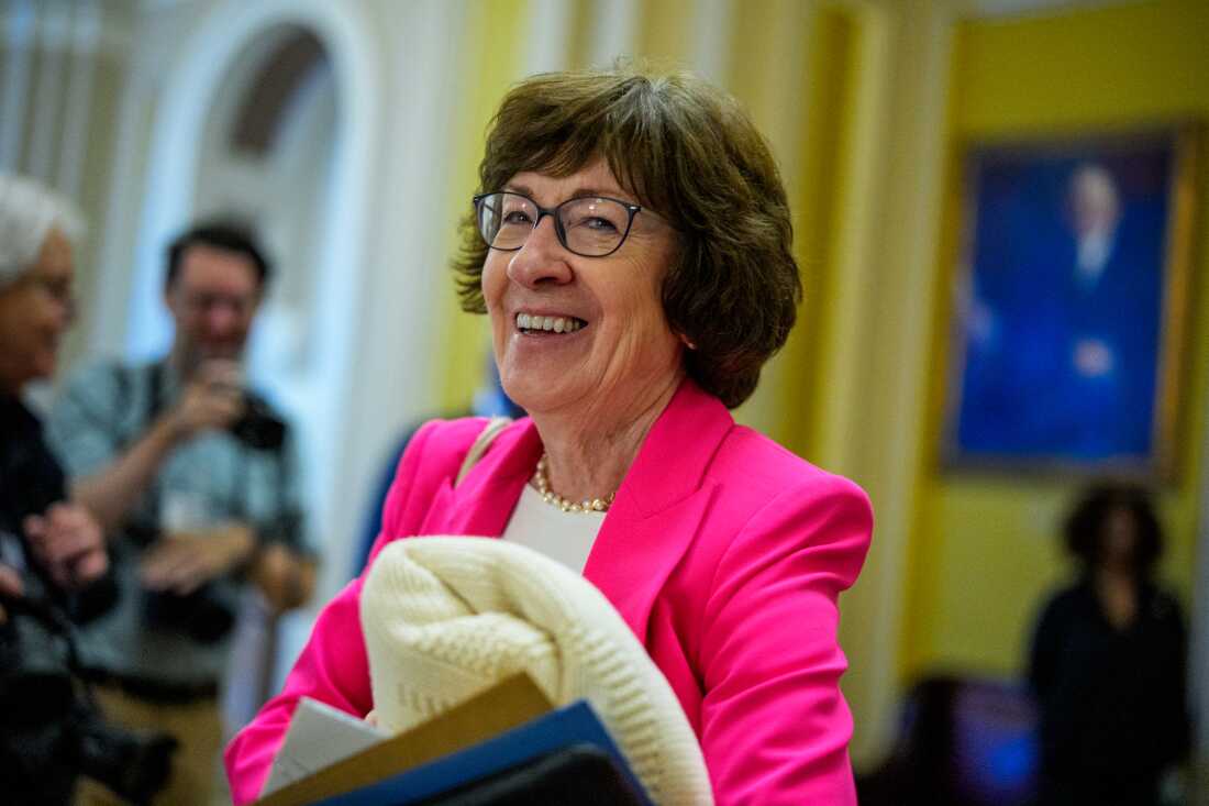 ]Sen. Susan Collins (R-ME) holds a blanket as she walks off the Senate floor after the Senate stayed in session throughout the night at the U.S. Capitol Building on July 1, 2025 in Washington, D.C.
