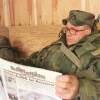 US soldier Sgt. John Hubbuch of Versailles, Ky., one of the members of NATO led-peacekeeping forces in Bosnia reads Stars and Stripes newspaper on Sunday Feb. 14, 1999. (AP Photo/Amel Emric, File)