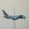 The U.S. and other nations have agreed to tap into oil reserves, but the move might not do much to bring jet fuel prices down rapidly, an expert tells NPR. It's one way violence in the Middle East can affect flights around the world. Here, an Emirates airliner prepares to land at Dubai's main airport on Sunday.