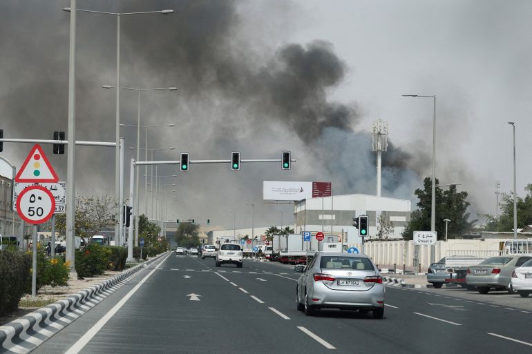 Smoke rises after reported Iranian missile attacks, following United States and Israel strikes on Iran, as seen from Doha, Qatar