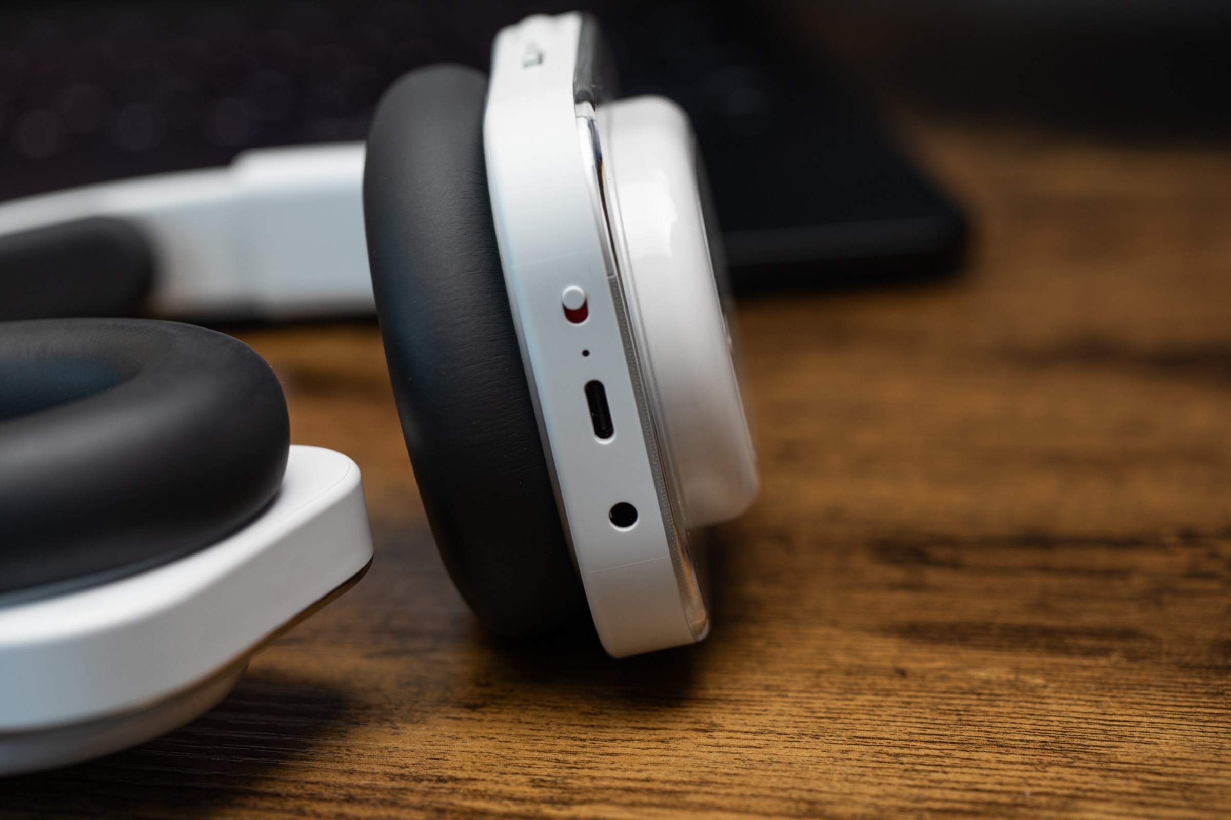 A closeup of the Nothing Headphone A connection ports and on switch.