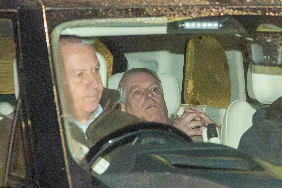 Ex-Prince Andrew ducking down in the back of a car after his arrest
