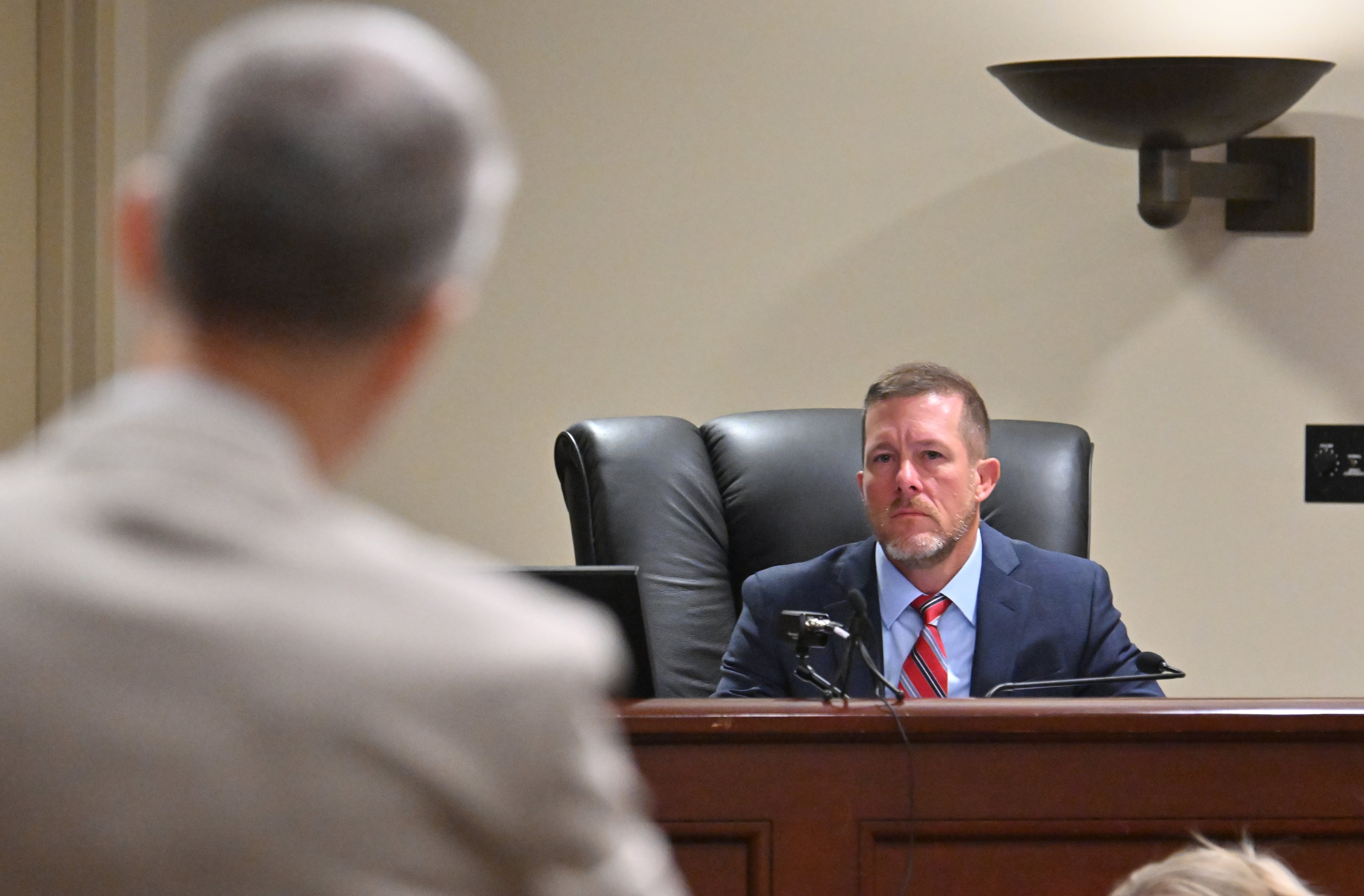 District Attorney Brad Smith (foreground) speaks to Barrow County Superior Court Judge Nicholas Primm during a court hearing last year. (Hyosub Shin/AJC)