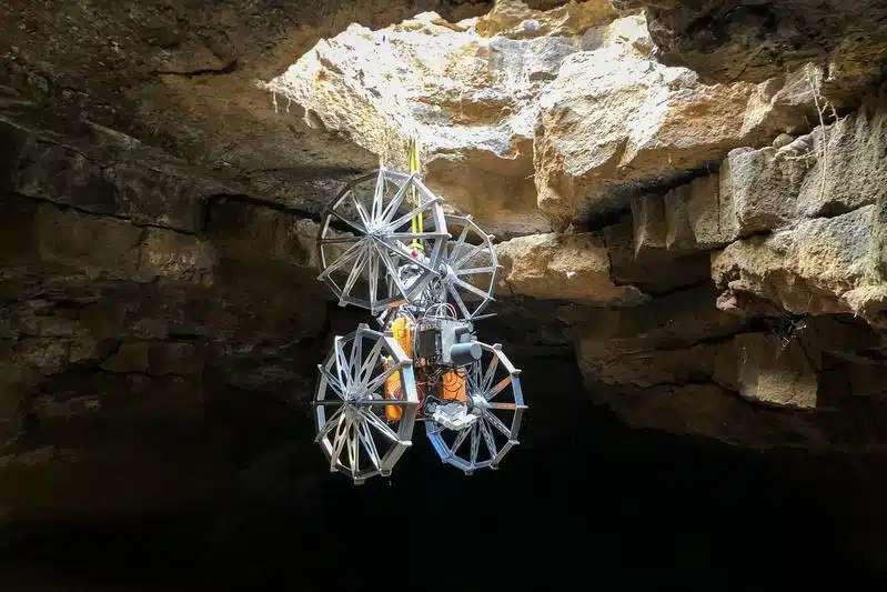 Robotic Explorer Being Lowered Into The Cave Using A Cable Management And Anchoring System.