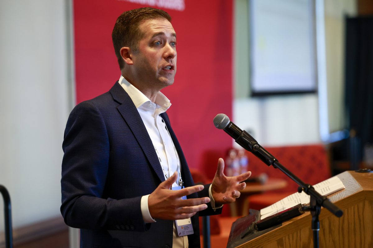 A photo of 9News anchor Kyle Clark giving a speech