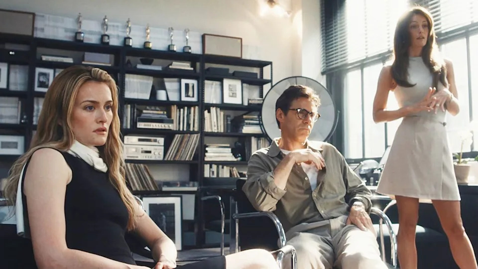 Sarah Pidgeon as Carolyn Bessette and Alessandro Nivola as Calvin Klein, and Leila George as Kelly Klein on 'Love Story'Credit: FX