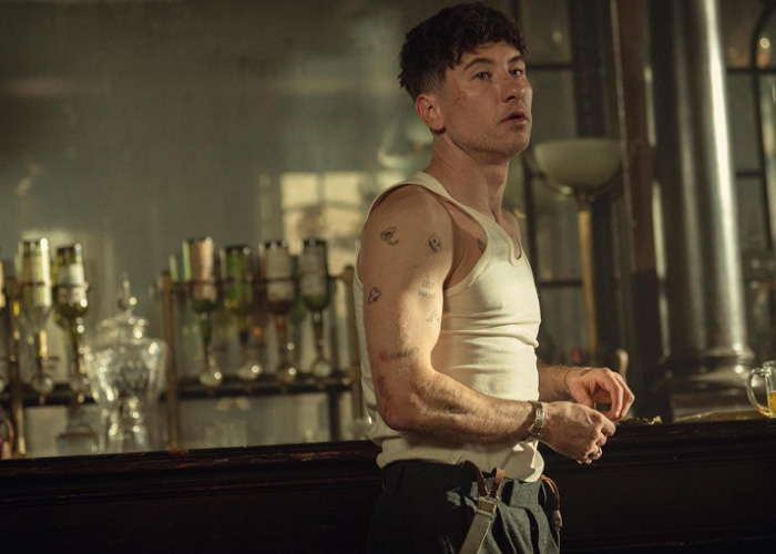 Barry Keoghan in a sleeveless shirt at a bar, reflecting on his acting career amid backlash from fans.