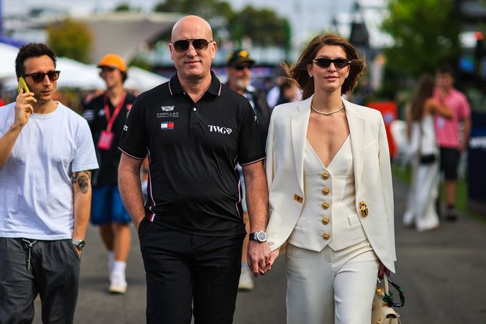 Cadillac F1 Team CEO Dan Towriss walks in the paddock with his wife Cassidy 