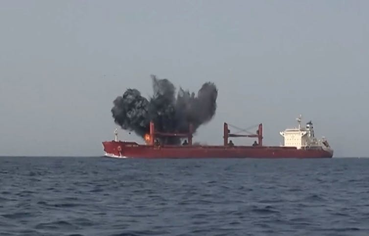 An explosion hits a commercial ship.