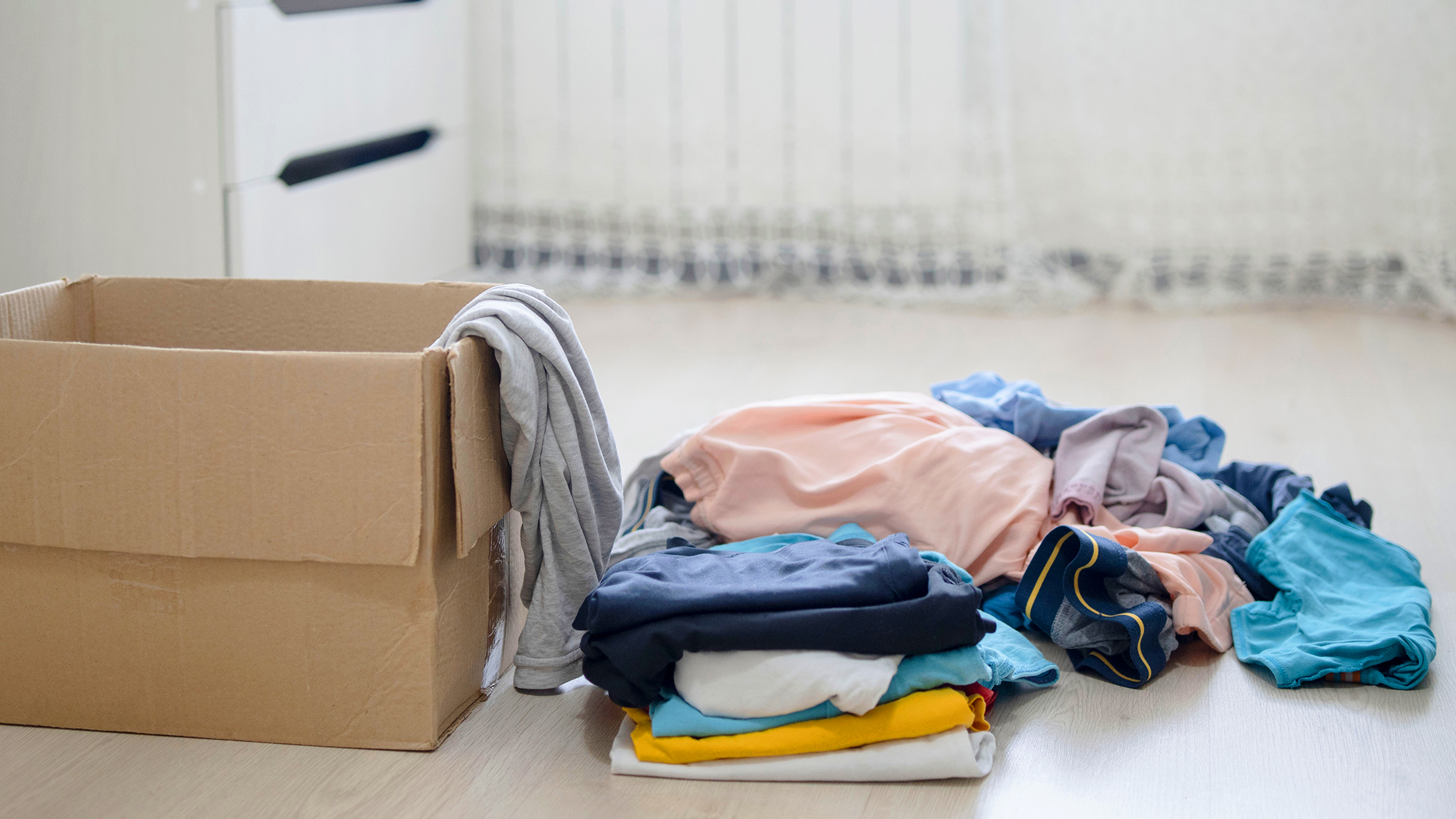Decluttering clothes on the floor