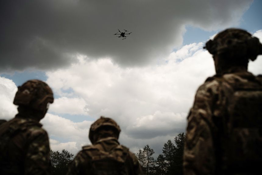Soldiers look at a drone in the region of Dnipropetrovsk, Ukraine, on June 14, 2025.