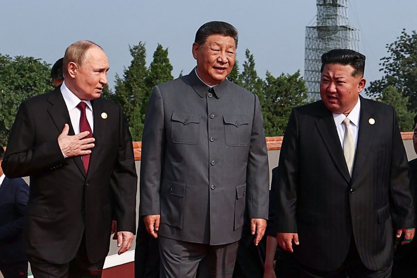 China's Xi Jinping with his guests, Russia's President Vladimir Putin with and North Korea's Kim Jong Un, before a military parade in Beijing's Tiananmen Square on September 3, 2025.