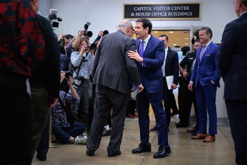 Senate Minority Leader Chuck Schumer, left, talks with Rubio on January 7 in Washington, DC. Even from a distance, the gap between Rubio's foot and the heel of his shoe can be seen.