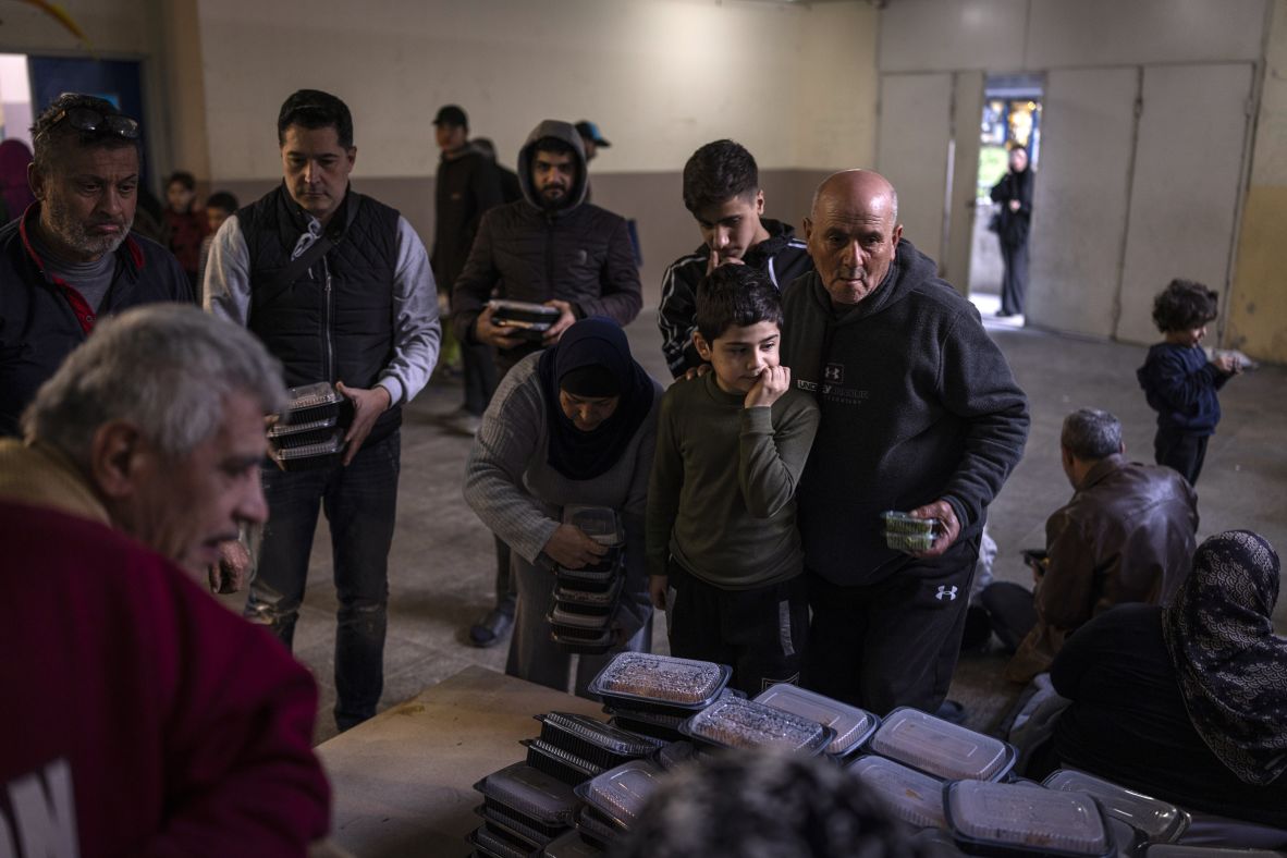 Donated meals are distributed Friday to displaced people in Beirut, Lebanon, who fled airstrikes in the southern suburbs.