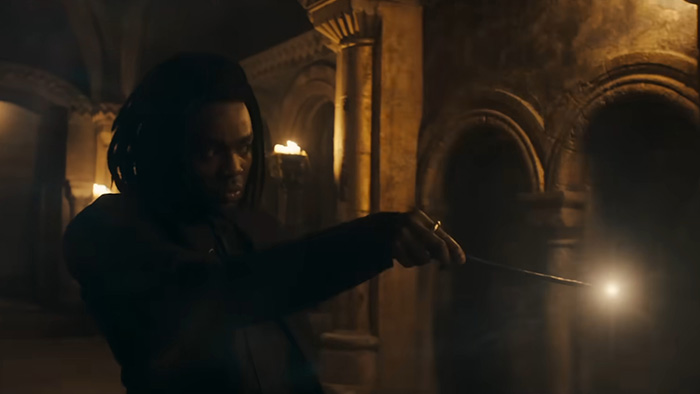 Actor holding a wand casting magic in HBO Harry Potter series trailer causing fans to react over character race change.