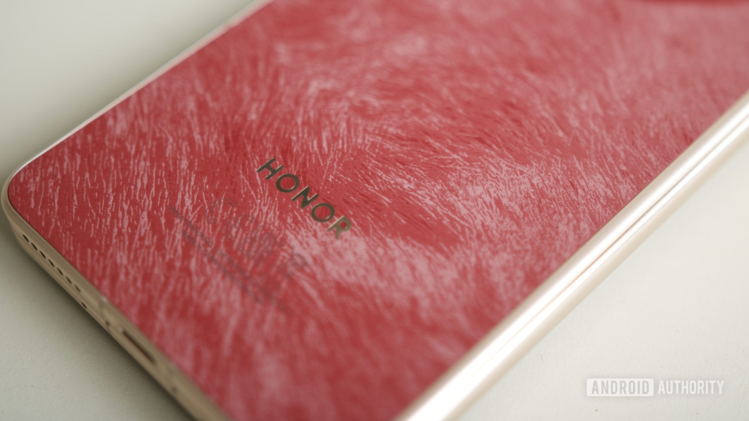 A close-up of the back of the HONOR Magic V6 in red.