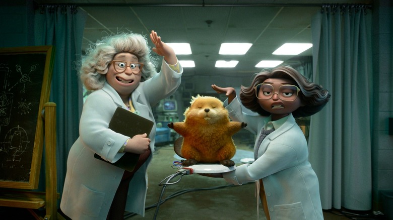Two scientists holding up a robot beaver in Hoppers