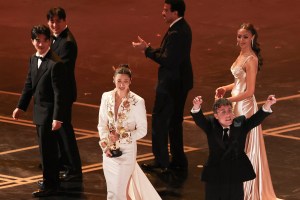 South Korean-US singer Ejae and US songwriter Mark Sonnenblick (R) accept the award for Best Music (Original Song) for "Golden" from "KPop Demon Hunters" alongside onstage during the 98th Annual Academy Awards at the Dolby Theatre in Hollywood, California on March 15, 2026. (Photo by Patrick T. Fallon / AFP via Getty Images)