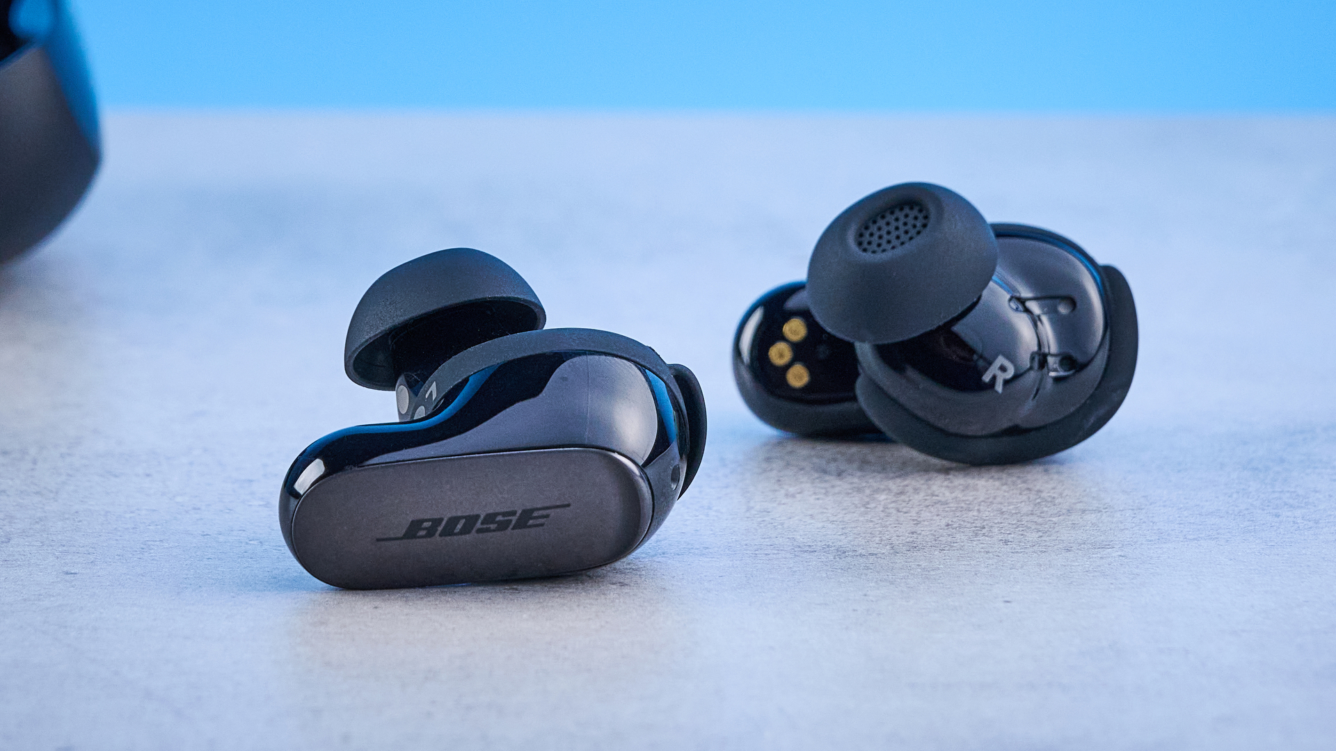 the bose quietcomfort ultra earbuds 2nd gen against the blue tom's guide background