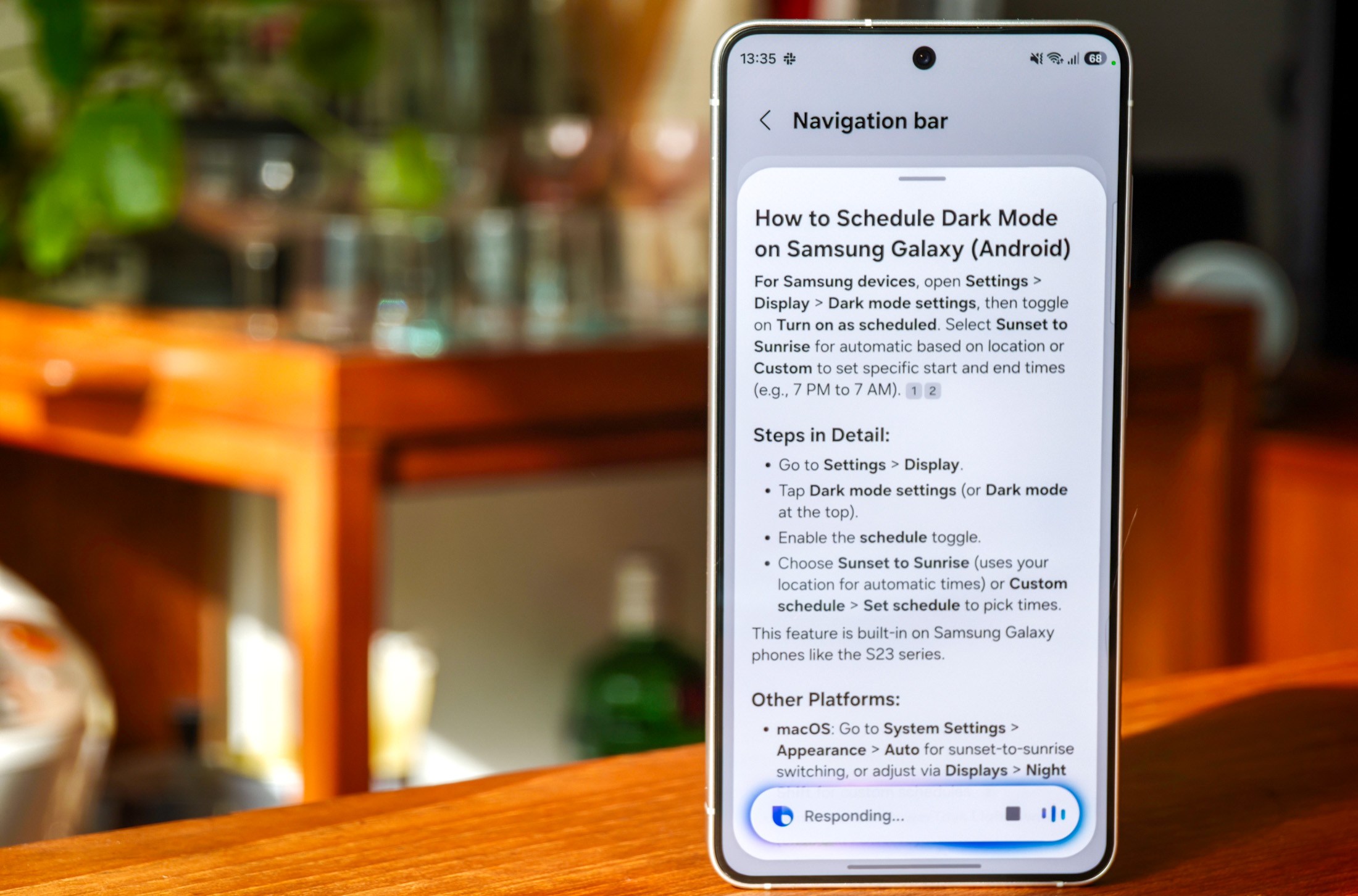 Photo of Bixby AI assistance on a Galaxy S26, bringing up a detailed explanation of how to schedule Dark Mode