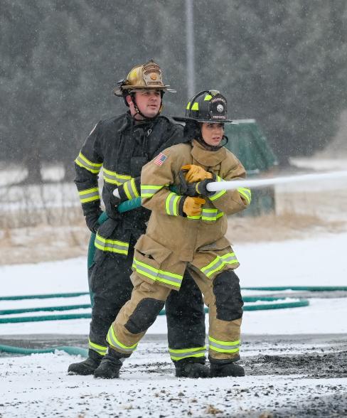 Noem conducts a firefighting simulation at Coast Guard Base Kodiak, in Kodiak, Alaska, March 17, 2025.