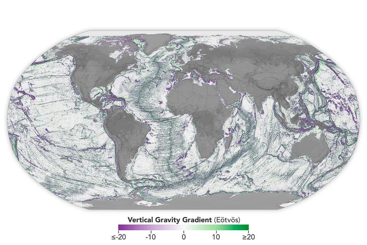 A global map of the seafloor using data captured by the SWOT satellite. Purple shows regions that are lower; green shows features that are higher. Credit: NASA Earth Observatory