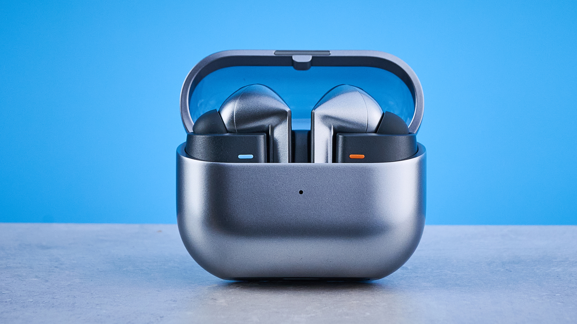 the samsung galaxy buds 3 pro photographed against the blue tom's guide background