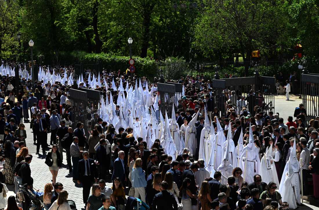 Penitents from the La Paz brotherhood parade in the Palm Sunday procession in Seville on March 29, 2026. 