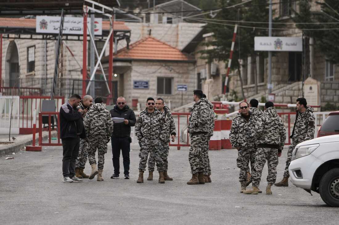 Members of Lebanon's General Security stand at the Masnaa border crossing in the Bekaa valley, eastern Lebanon, Sunday, April 5, 2026.