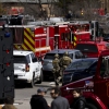 Law enforcement vehicles, fire trucks and other vehicles crowd a street near Temple Israel in West Bloomfield, Mich., following reports of an active shooter on Thursday.