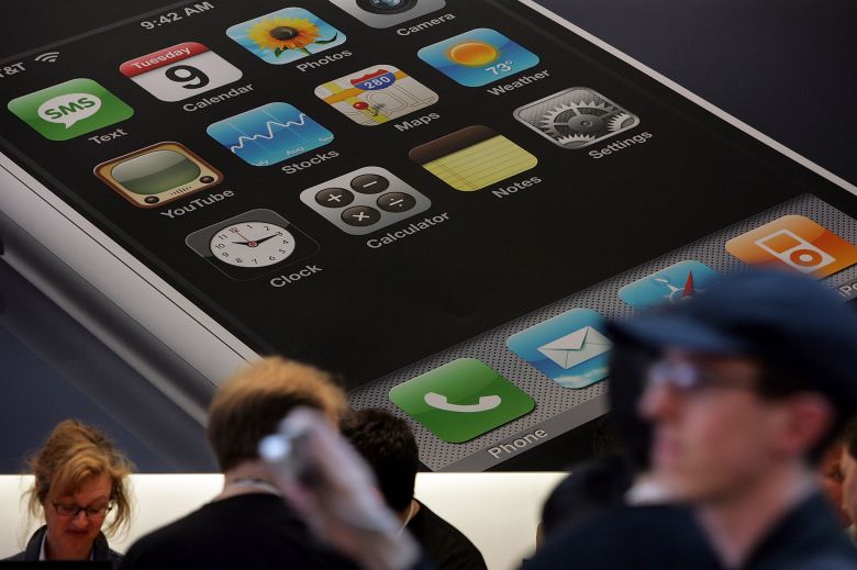 A poster of the new Apple iPhone hangs in an Apple store June 29, 2007 in San Francisco, California.