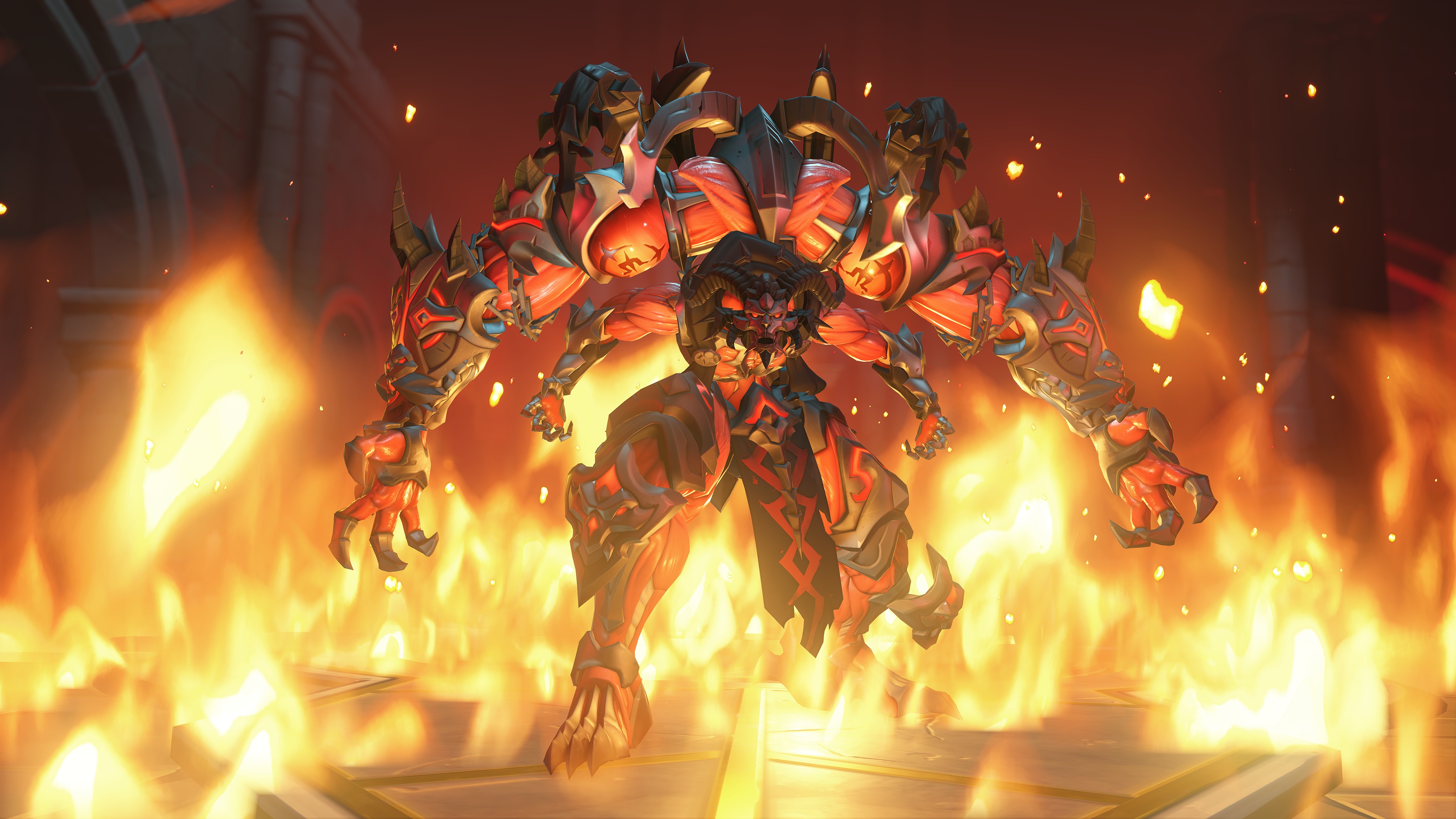 A monstrous, armored creature with four arms stands menacingly amid towering flames. 