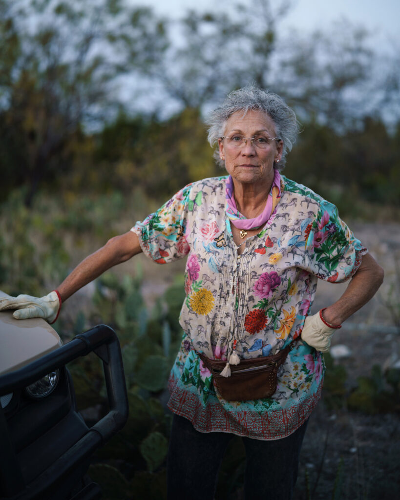 Jackie Chesnutt poses for a portrait on her property in Tom Green County, Texas. She has documented pollution from oil wells and filed complaints with state regulators.