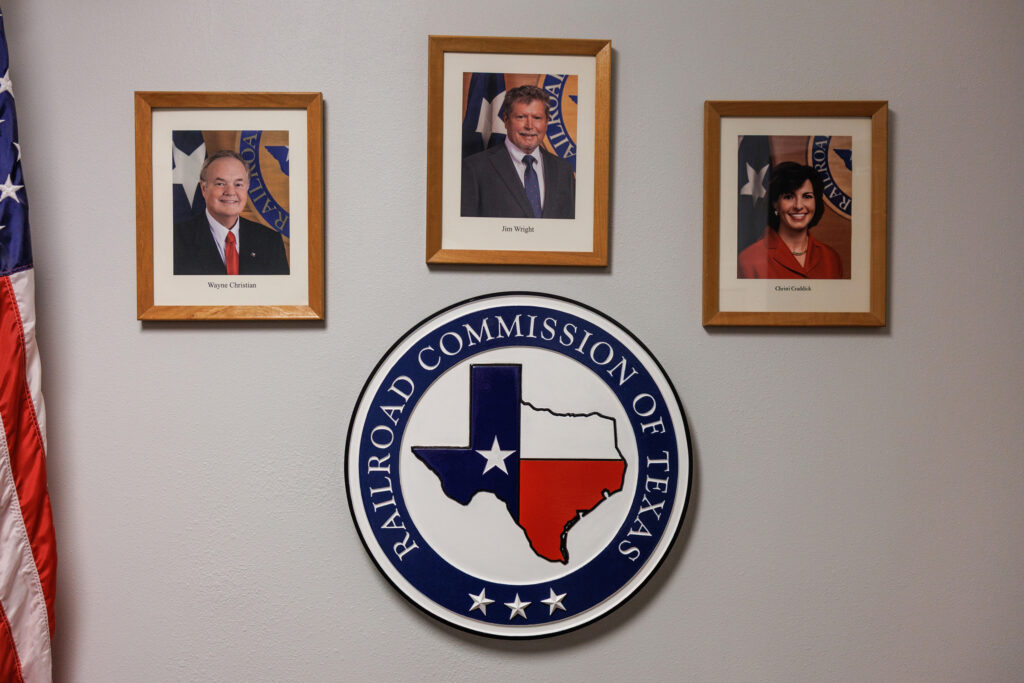 Pictures of the three Railroad Commissioners of Texas hang in the office in San Angelo, Texas. From left: Wayne Christian, Jim Wright and Christi Craddick.