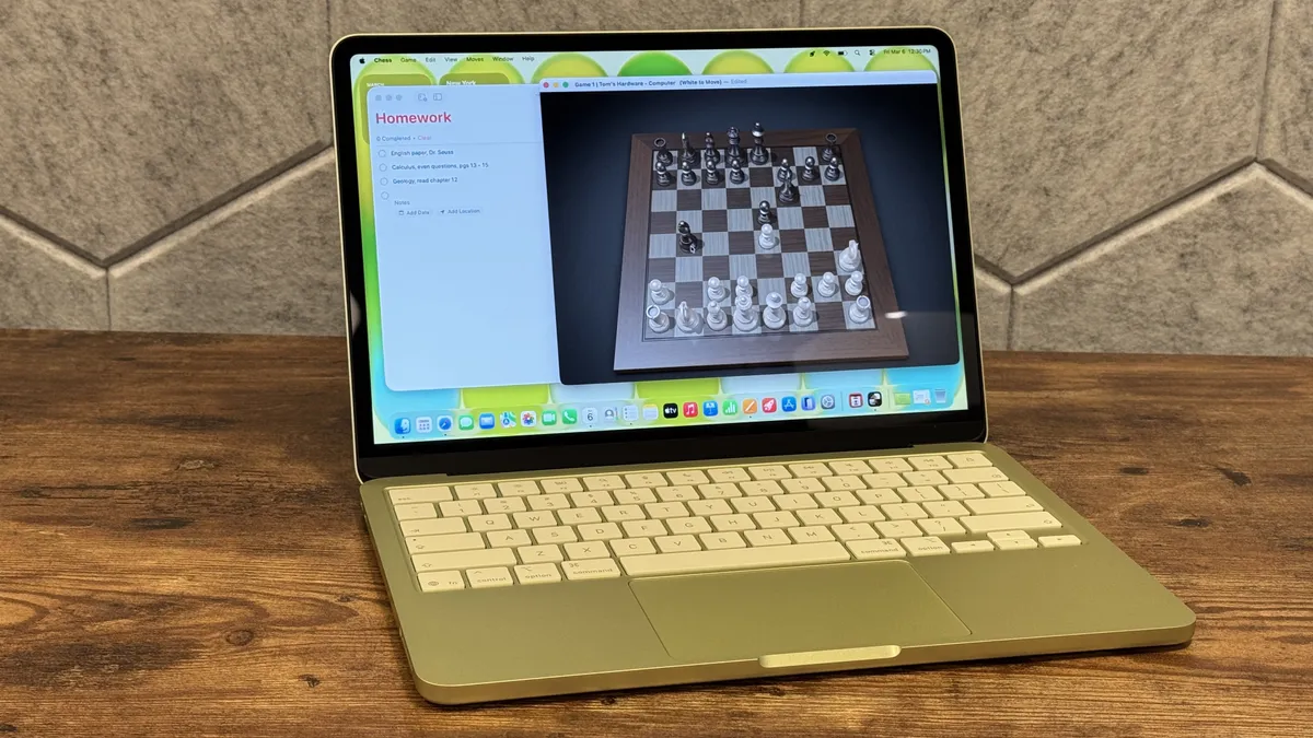 A laptop on a wooden table displays a chess game and a homework list. The screen is vibrant, contrasting with the warm, rustic background.