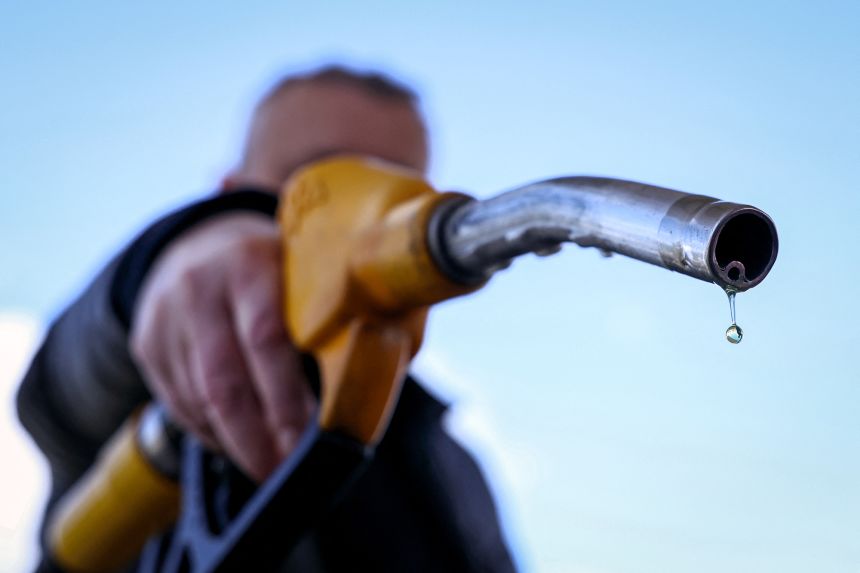 A drop of petrol falls from the nozzle of a petrol pump at a petrol station in Vélizy-Villacoublay, near Paris, on March 9.